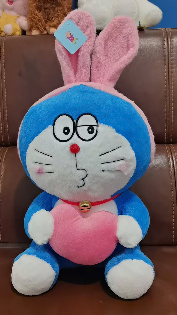 DOREMON TAI THỎ ÔM TIM 50CM